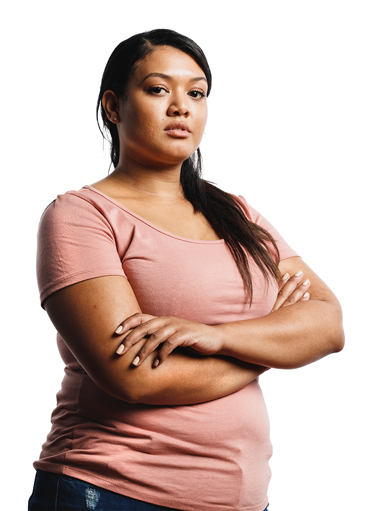 Stoic woman standing with arms folded